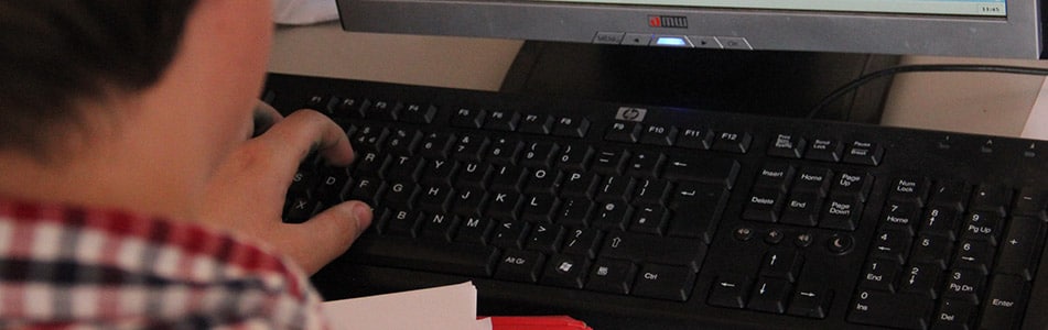 student at keyboard